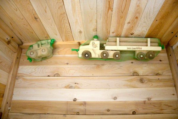 photo of a large and small wooden log truck toy