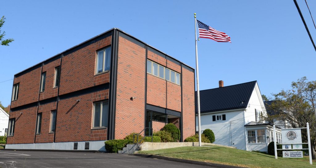 photo of the master logger certification office building with American flag from the outside